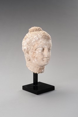 Lot 1138 - A STUCCO HEAD OF BUDDHA, GANDHARA