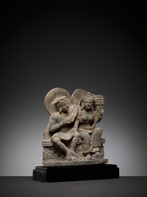 Lot 559 - A SCHIST RELIEF DEPICTING HARITI AND PANCHIKA, KUSHAN PERIOD