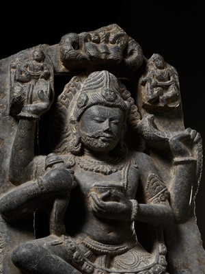 Lot 166 - A LARGE AND EXCEPTIONAL GRAY SCHIST STATUE OF A DANCING SHIVA, EARLY MALLA DYNASTIES