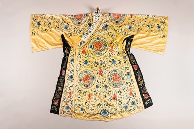 Lot 966 - A YELLOW GROUND EMBROIDERED SILK ROBE, QING