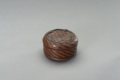 Lot 350 - A WOVEN CIRCULAR COPPER AND BRASS BOX AND COVER