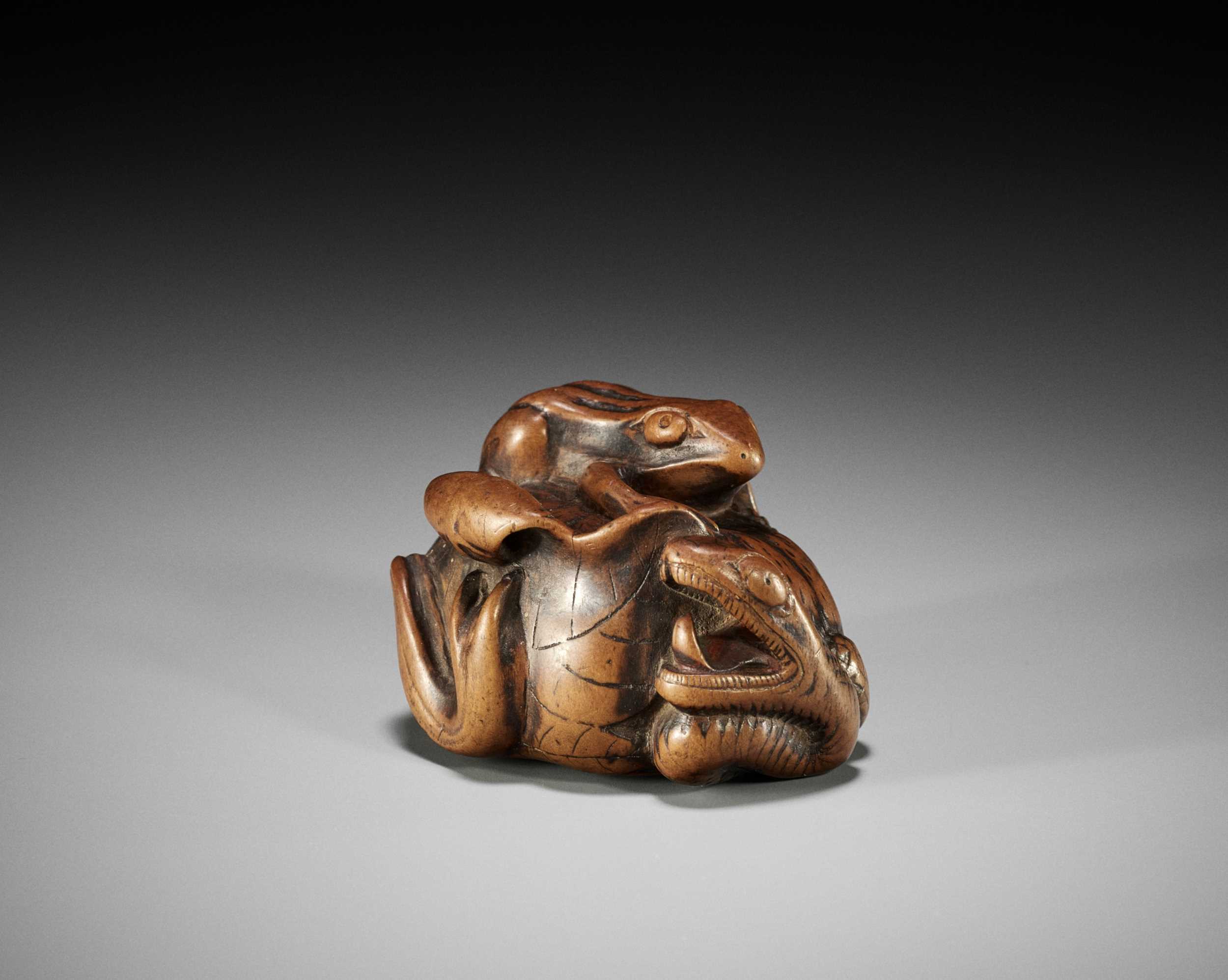 Lot 1402 - ARIMA TOMONOBU: A LARGE NAGOYA SCHOOL WOOD NETSUKE OF THE SANSUKUMI