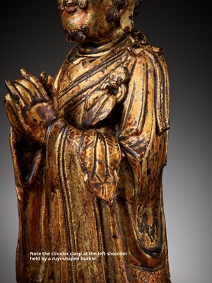 Lot 386 - A RARE GILT BRONZE FIGURE OF A BUDDHIST DISCIPLE, POSSIBLY ANANDA, MING DYNASTY
