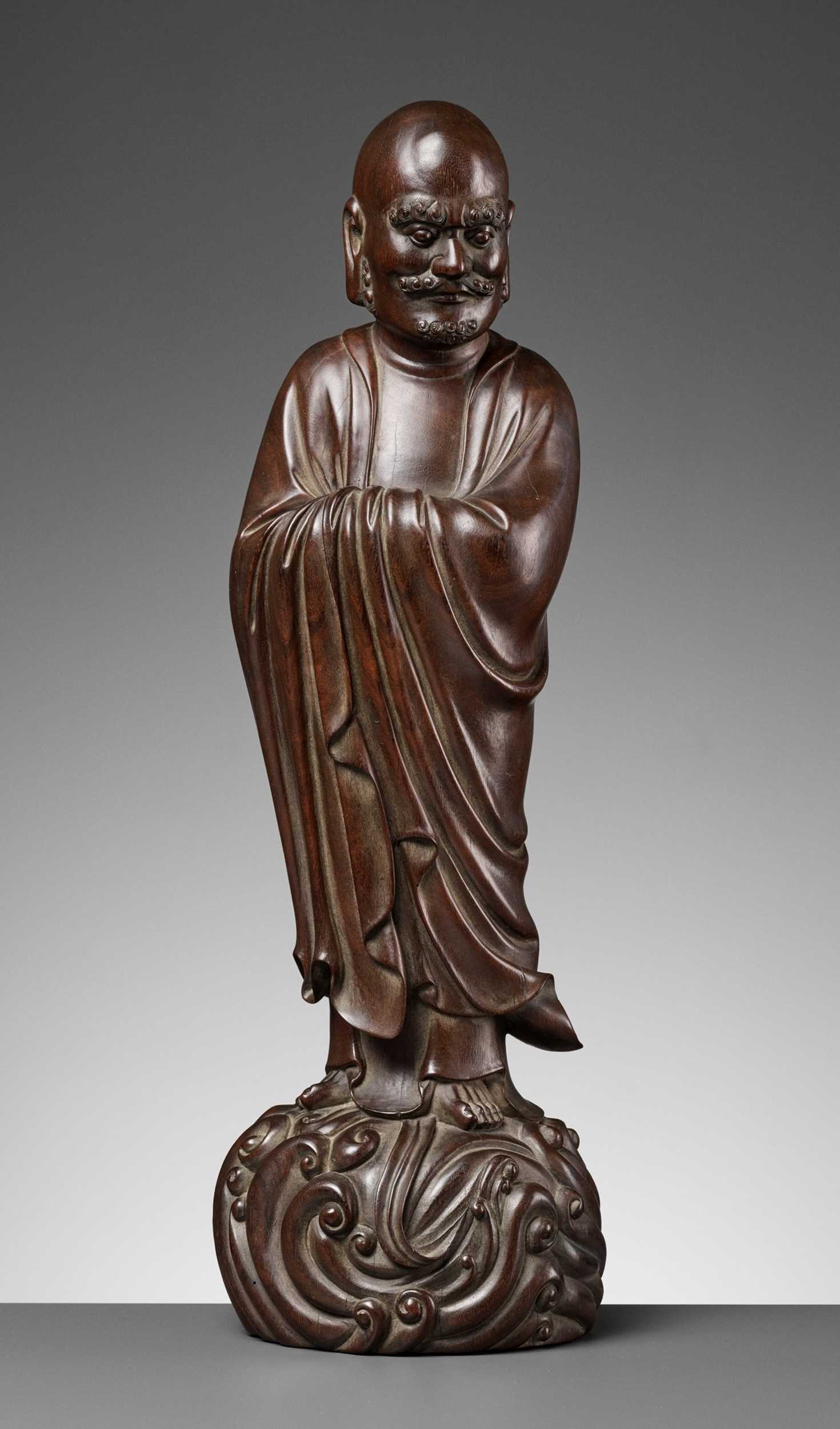 Lot 96 - A LARGE HARDWOOD FIGURE OF DAMO (BODHIDHARMA), LATE MING TO EARLY QING DYNASTY