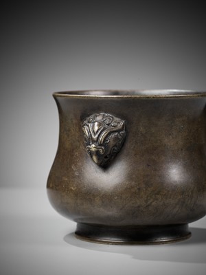 Lot 490 - A BRONZE CENSER WITH PHOENIX MASK HANDLES, 17TH-18TH CENTURY