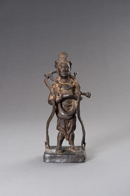 Lot 93 - A LACQUER GILT BRONZE FIGURE OF A GUARDIAN KING, MING