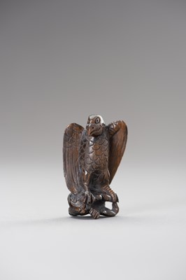 Lot 508 - A WOOD NETSUKE OF AN EAGLE SNATCHING A RABBIT