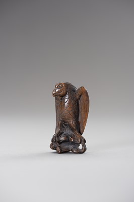 Lot 508 - A WOOD NETSUKE OF AN EAGLE SNATCHING A RABBIT