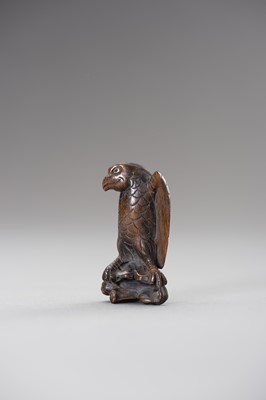 Lot 508 - A WOOD NETSUKE OF AN EAGLE SNATCHING A RABBIT