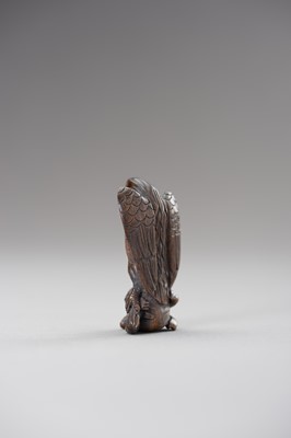 Lot 508 - A WOOD NETSUKE OF AN EAGLE SNATCHING A RABBIT