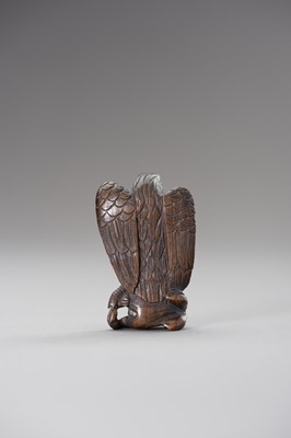 Lot 508 - A WOOD NETSUKE OF AN EAGLE SNATCHING A RABBIT