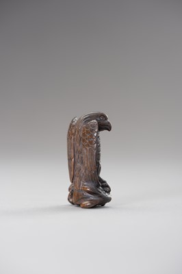 Lot 508 - A WOOD NETSUKE OF AN EAGLE SNATCHING A RABBIT