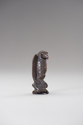 Lot 508 - A WOOD NETSUKE OF AN EAGLE SNATCHING A RABBIT