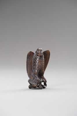 Lot 508 - A WOOD NETSUKE OF AN EAGLE SNATCHING A RABBIT