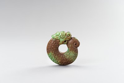 Lot 185 - AN ARCHAISTIC TURQUOISE MATRIX ‘COILED DRAGON’ PENDANT, 1900s