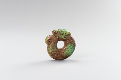 Lot 185 - AN ARCHAISTIC TURQUOISE MATRIX ‘COILED DRAGON’ PENDANT, 1900s
