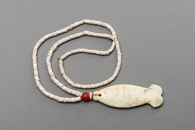 Lot 259 - A STONE NECKLACE WITH A ‘FISH’ JADE PENDANT