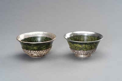 Lot 220 - A PAIR OF SILVER MOUNTED SPINACH-GREEN JADE BOWLS