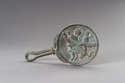 Lot 1153 - A MASSIVE GANDHARA STYLE BRONZE MIRROR WITH A FIGURAL SCENE