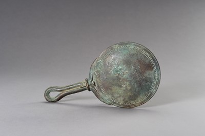Lot 1153 - A MASSIVE GANDHARA STYLE BRONZE MIRROR WITH A FIGURAL SCENE