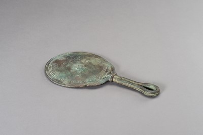 Lot 1153 - A MASSIVE GANDHARA STYLE BRONZE MIRROR WITH A FIGURAL SCENE