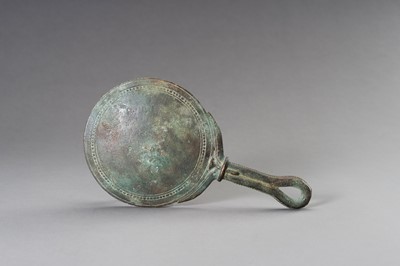 Lot 1153 - A MASSIVE GANDHARA STYLE BRONZE MIRROR WITH A FIGURAL SCENE