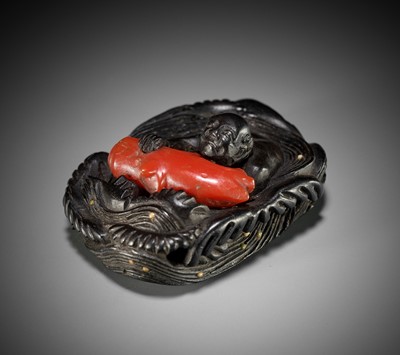 Lot 435 - A RARE EBONY AND CORAL NETSUKE OF AN ISLANDER IN WAVES