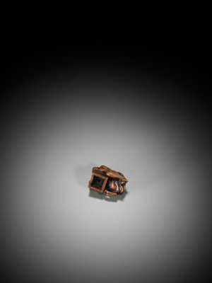 Lot 160 - AN UNUSUAL SHUNGA WOOD NETSUKE OF OKAME AS A RAT CATCHER