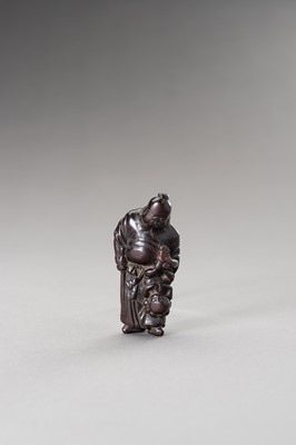 Lot 510 - A WOOD NETSUKE OF SHOKI AND ONI