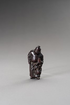 Lot 510 - A WOOD NETSUKE OF SHOKI AND ONI