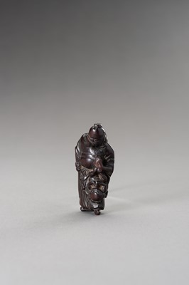 Lot 510 - A WOOD NETSUKE OF SHOKI AND ONI