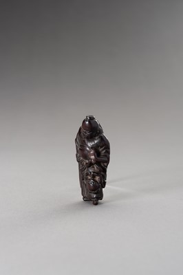 Lot 510 - A WOOD NETSUKE OF SHOKI AND ONI