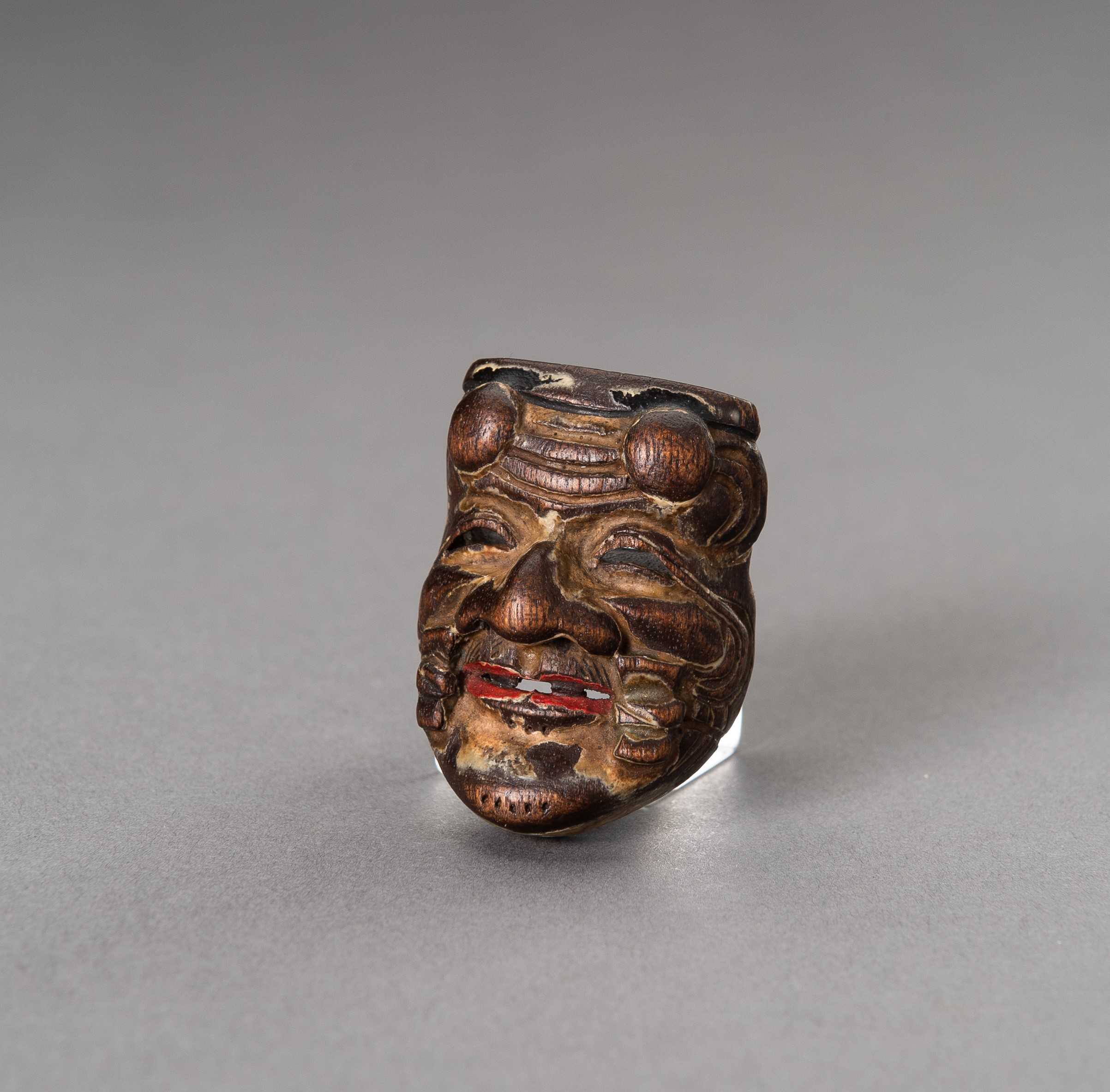 Lot 458 - A HINOKI WOOD SAISHIKI MASK NETSUKE OF OKINA