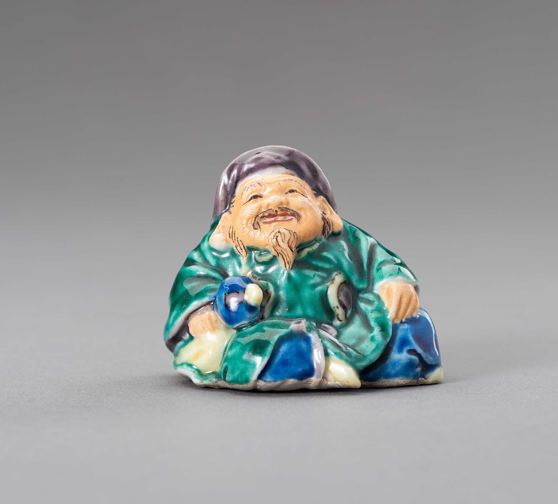 Lot 468 A POLYCHROME YAKIMONO PORCELAIN NETSUKE OF lot-468-a-polychrome-yakimono-porcelain-netsuke-of