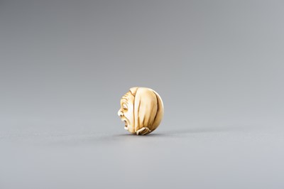 Lot 604 - AN IVORY OJIME WITH A YAWNING MAN
