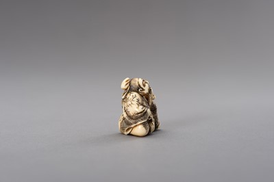 Lot 525 - AN IVORY NETSUKE OF A TAILOR WITH PAIR OF SCISSORS