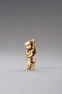 Lot 521 - AN IVORY NETSUKE OF A KYOGEN ACTOR WITH FOX MASK