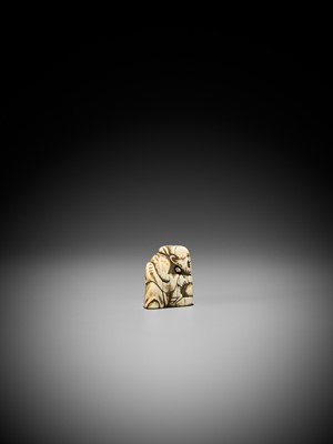 AN IVORY NETSUKE OF A SAGE WITH HOZUKI