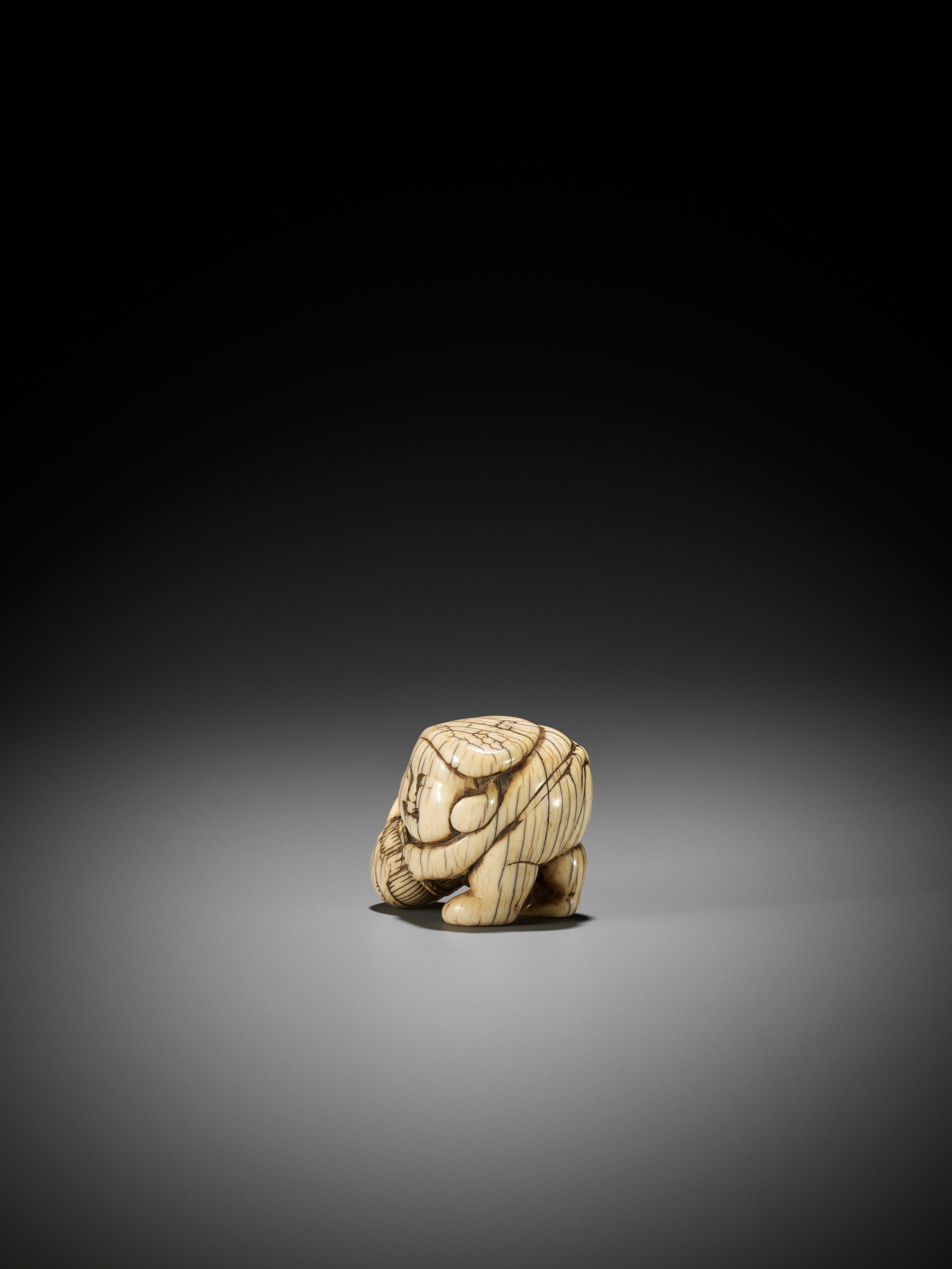 Lot 1429 - AN IVORY SHUNGA NETSUKE OF DAIKOKU WITH