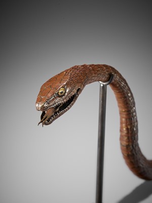 A RARE AND IMPRESSIVE PATINATED BRONZE ARTICULATED MODEL OF A SNAKE