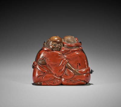 Lot 364 - AN UNUSUAL NEGORO-STYLE LACQUERED WOOD TONKOTSU DEPICTING TWO WRESTLERS