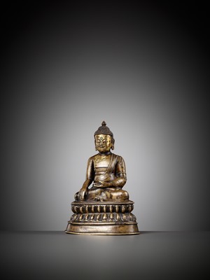 Lot 169 - A SILVER AND COPPER-INLAID GILT BRASS FIGURE OF BUDDHA VAJRASANA, TIBET, 15TH – 16TH CENTURY