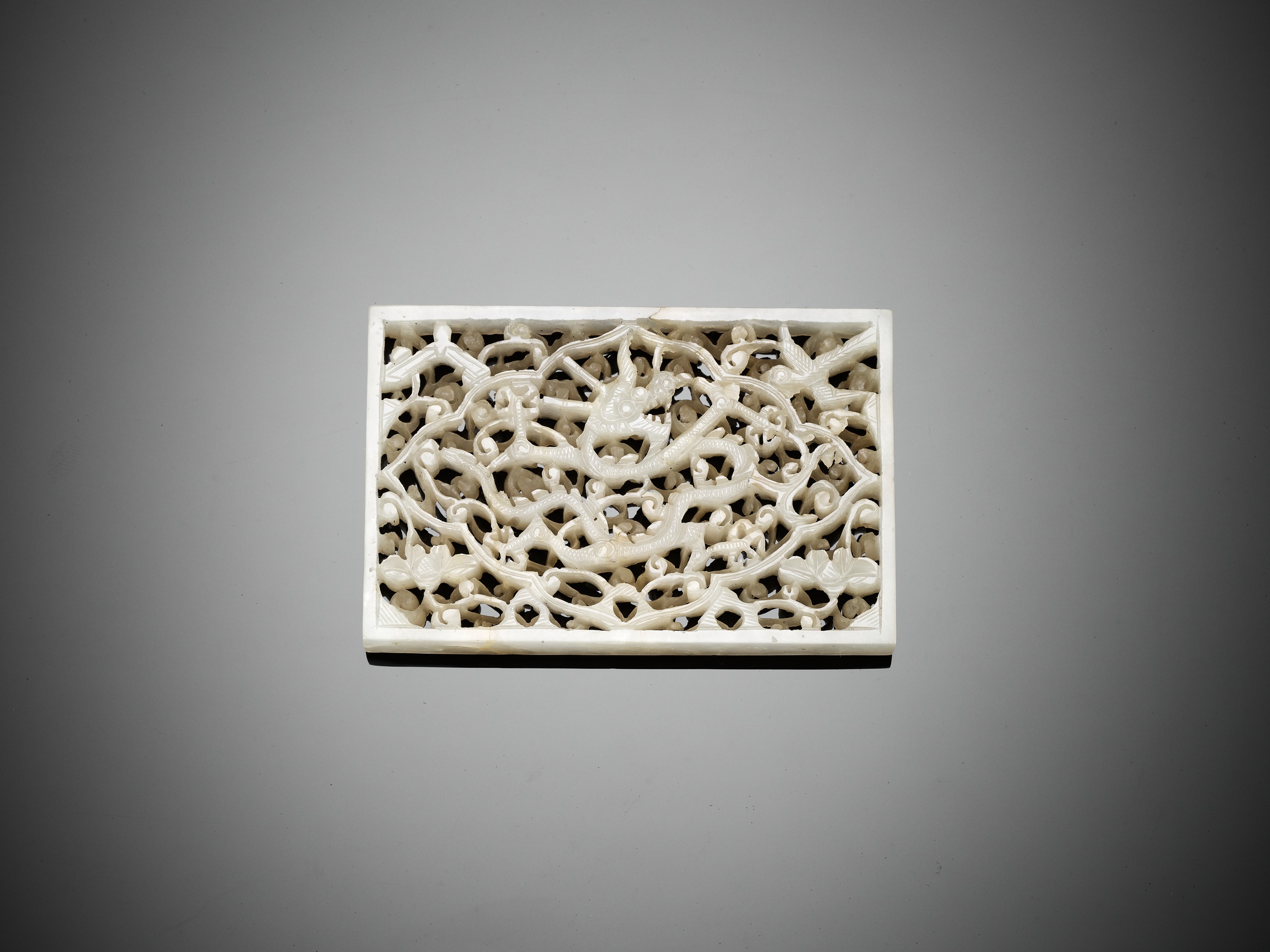 Lot 331 - A RECTANGULAR WHITE JADE 'DRAGON' PLAQUE,