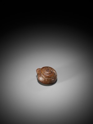 Lot 102 - BOKUZAN: A RARE BAMBOO NETSUKE OF A SNAIL RETRACTED WITHIN ITS SHELL