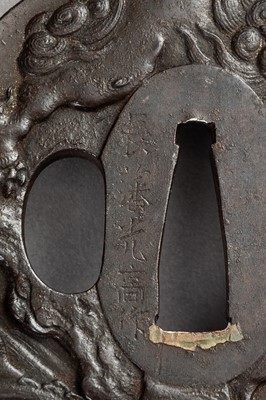 Lot 640 - CHOHAN MITSUTAKA: AN IRON TSUBA WITH SHISHI