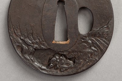 Lot 640 - CHOHAN MITSUTAKA: AN IRON TSUBA WITH SHISHI