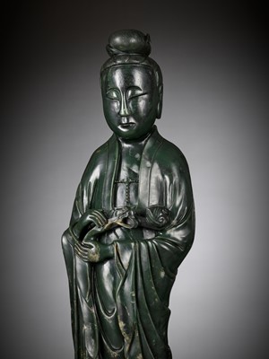 Lot 61 - A LARGE AND MASSIVE SPINACH-GREEN KHOTAN JADE FIGURE OF GUANYIN, PROBABLY TAKEN FROM THE OLD SUMMER PALACE IN BEIJING IN 1861