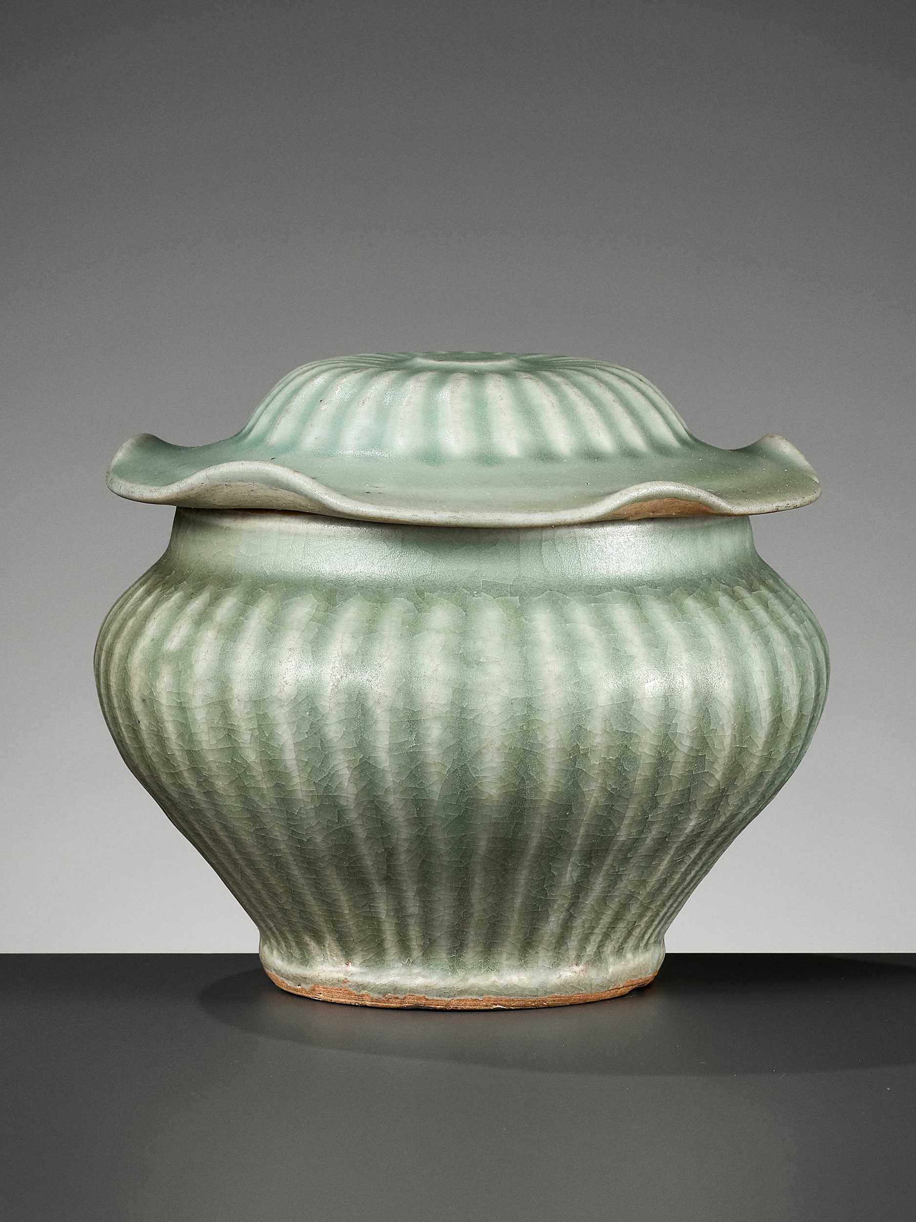Lot 397 - A LONGQUAN CELADON RIBBED JAR AND COVER, YUAN DYNASTY