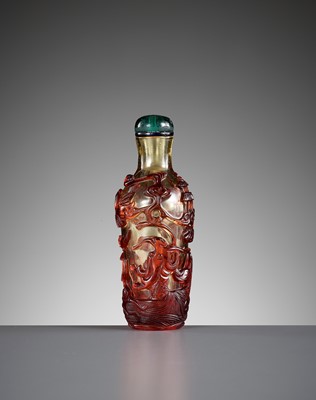 A RUBY-RED OVERLAY GLASS ‘DRAGON CARP’ SNUFF BOTTLE, QING DYNASTY