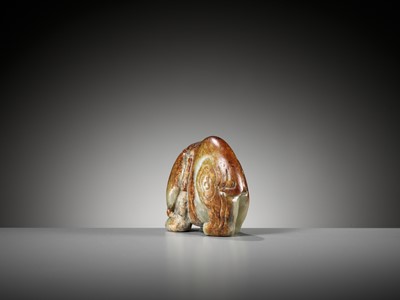 Lot 41 - A CELADON AND RUSSET JADE FIGURE OF AN ELEPHANT, MING DYNASTY